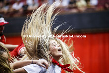 Kelly Thompson, a sophomore and member of Gamma Phi Beta, flips her hair during the Triad 7--Alpha T