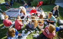 Students from Alpha Tau Omega, Gamma Phi Beta, Delta Delta Delta, Acacia, Sigma Alpha Mu work on the