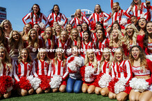 Hannah Huston, from the tv show The Voice, poses with the cheer squad before the game. Nebraska vs. 