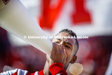 The male cheerleaders use their megaphones to rally the crowd. Nebraska vs. Northwestern University 