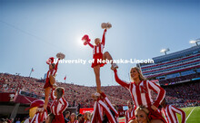 The Cheer Squad perform stunts at the Nebraska vs. Northwestern University football game. Homecoming