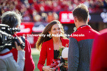Senior Cheyenne Gerlach, homecoming royalty finalist, at the halftime ceremony of the Nebraska-North