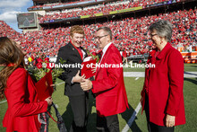 Seniors Cheyenne Gerlach and Bryce Lammers laugh with Chancellor Ronnie Green and Jane, his wife, af