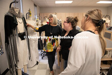 Sandra Starkey (left), assistant professor in Textiles, Merchandising and Fashion Design, looks over