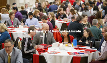Table groups read discussion prompts to facilitate roundtable talks before the presentations. State 
