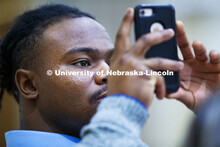 Mikale Wilbon, Graduate Student in Educational Administration, photographs Marco Barker as he gives 