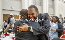 Maurice Stinnett, Vice President for Diversity and Inclusion with the BSE Global, hugs Calvin Sandid