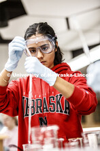 Sophia Deras measures her solution in a Chem 109 lab to determine absorption spectra and best wavele