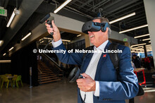 Carson Board Member, Jeff Stozing, being shown how to use the HP Backpack VR set at the Carson dedic