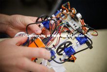 Students in Mark Bauer ECEN 102 - Introduction to Electrical Engineering class work on small robots 