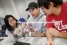 Students in Mark Bauer ECEN 102 - Introduction to Electrical Engineering class work on small robots 