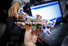 Students in Mark Bauer ECEN 102 - Introduction to Electrical Engineering class work on small robots 