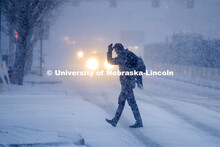 Some Mondays are more Monday than others. Monday morning snowstorm. Person crossing the street in a 