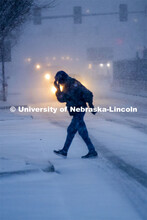 Some Mondays are more Monday than others. Monday morning snowstorm. Person crossing the street in a 