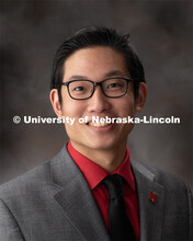 Studio portrait of John Tessalee, Program Coordinator, OASIS. December 17, 2019. 
