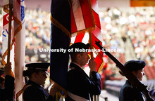 The ROTC march in carrying the flag. December Undergraduate commencement at Pinnacle Bank Arena. Dec
