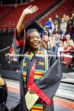 Aleece Barnard waves to family and friends as she enters the arena. December Undergraduate commencem