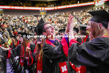 Chase Nissen, and Kristen Nett celebrate their graduation as part of Regent Clare's greeting to the 