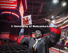 Septer Duang celebrates his degree with family and friends as he leaves the arena. December Undergra