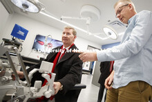 NU President Ted Carter tries out Shane Farritors's surgery robot.  President Carter manipulated the