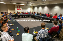 Student leaders talk with Ted Carter during the Jan. 16 pizza dinner in the Nebraska Union as part o