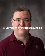 Studio portrait of L.D. Miller, Research Process Analyst for the Office of Research and Development.