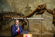 Chancellor Ronnie Green introduces Ross Secord and his Nebraska Lecture as a Stegomastodon skeleton 