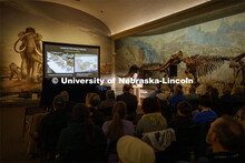 Ross Secord delivers his Nebraska Lecture as a Stegomastodon skeleton stands in the background. Seco