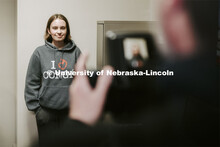 Grace Gawecki has her photo taken by Scott Hurst. She was a winner in the Husker Passport Giveaway s
