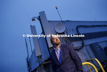 Gus Hurwitz, Nebraska Law professor researching rural broadband issues in Nebraska. He is standing a