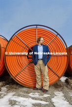 Gus Hurwitz, Nebraska Law professor researching rural broadband issues in Nebraska. Behind him are c