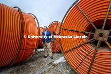 Gus Hurwitz, Nebraska Law professor researching rural broadband issues in Nebraska. Behind him are c