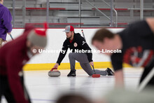 Colin Wooldrik of the UNL Curling Team throws a curling stone at the John Breslow Ice Arena. Nebrask