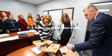 A job well done, Chancellor Ronnie Green give cookies to the Payroll and Travel staff for their hard