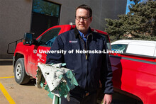 Berry Scott, Zone Preventive Maintenance Lead of FM&P Building Systems Maintenance, holds material f