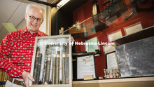 Mark Griep, professor of chemistry, holds the saccharometers Rachel Lloyd used in the late 19th cent