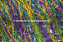 Pictured; a pile of Mardi Gras beads. Mardi Gras special meal at East Campus Dining Center. February