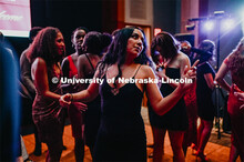 Huskers dance in formal attire during the 2020 OASIS Love Gala in the Wick Alumni Center. It is the 