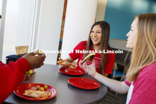 Cather Dining Center photoshoot. Young women eating together in the Cather Dining Center. March 2, 2