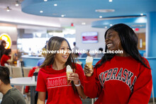 Cather Dining Center photoshoot. Young women eating ice cream in the Cather Dining Center. March 2, 