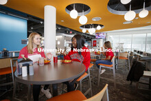 Cather Dining Center photoshoot. Young women eating together in the Cather Dining Center. March 2, 2