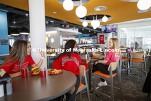 Cather Dining Center photoshoot. Young women eating together in the Cather Dining Center. March 2, 2