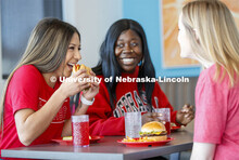 Cather Dining Center photoshoot. Young women eating together in the Cather Dining Center. March 2, 2