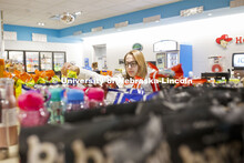 Herbie's Market at Cather Dining Center photoshoot. A young women shops in Herbie's Market. March 2,