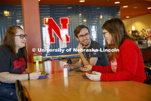 Harper Dining Center photo shoot. Students visit while enjoying their meal at Harper Dining Center. 