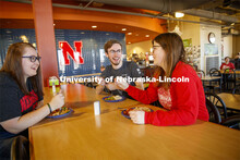 Harper Dining Center photo shoot. Students visit while enjoying their meal at Harper Dining Center. 