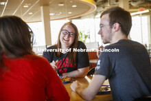 Harper Dining Center photo shoot. Students visit while enjoying their meal at Harper Dining Center. 