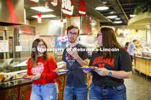 Harper Dining Center photo shoot. Students visit while looking for a place to sit at Harper Dining C