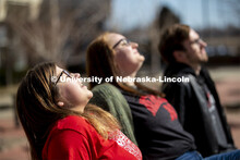 Harper Dining Center photo shoot. Students enjoying the sun while sitting outside the Harper Dining 