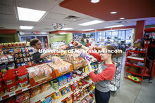 Harper Dining Center photo shoot. Students buying snacks at Herbie's Market outside Harper Dining Ha
